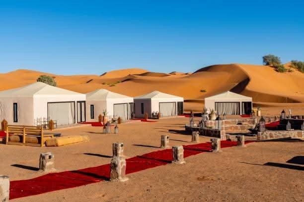 Luxury desert camp tents in dunes